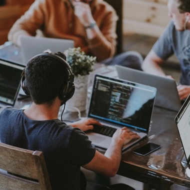 A man is working with a computer