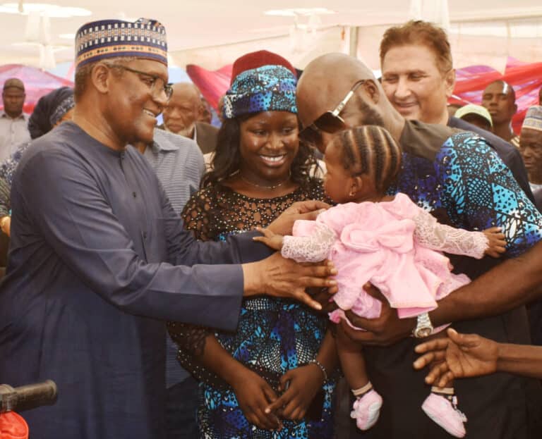 L-R: President/CE Dangote Industries Limited, Aliko Dangote congratulates overall winner of the outgrower scheme, Christiana Rufus with Group Managing Director, Dangote Sugar Refinery Plc, Ravindra Singhvi; at the Flag-off ceremony of 2022/2023 Crushing Season and Outgrower Scheme Awards at Dangote Sugar Refinery in Numan, Adamawa State yesterday.