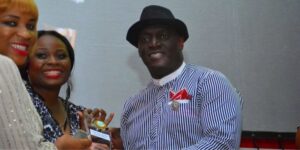 Sammie-Okposo-receiving-an-award