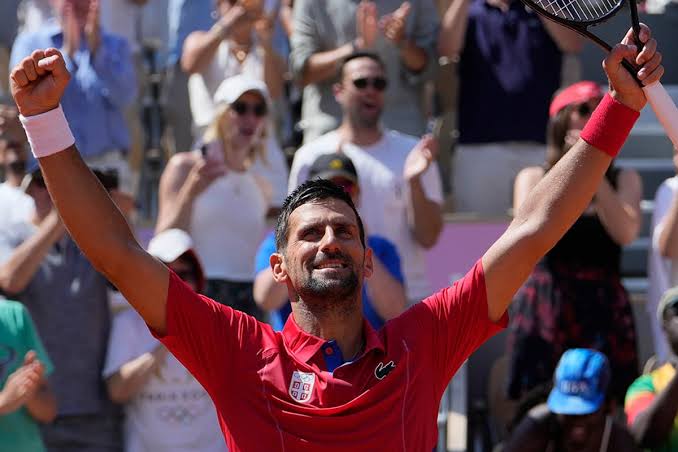 Djokovic reaches quarter-finals for record fourth time