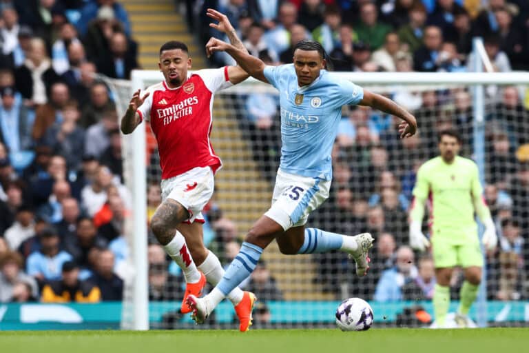 Arsenal's Brazilian striker #09 Gabriel Jesus (L) fights for the ball with Manchester City's Swiss defender #25 Manuel Akanji during the English Premier League football match between Manchester City and Arsenal at the Etihad Stadium in Manchester, north west England, on March 31, 2024. (Photo by Darren Staples / AFP) / RESTRICTED TO EDITORIAL USE. No use with unauthorized audio, video, data, fixture lists, club/league logos or 'live' services. Online in-match use limited to 120 images. An additional 40 images may be used in extra time. No video emulation. Social media in-match use limited to 120 images. An additional 40 images may be used in extra time. No use in betting publications, games or single club/league/player publications. / (Photo by DARREN STAPLES/AFP via Getty Images)